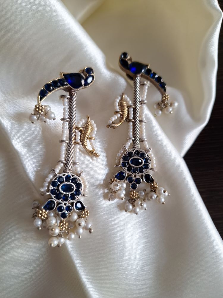 Akshara Veena pattern dual tone brass long studs - Dark blue