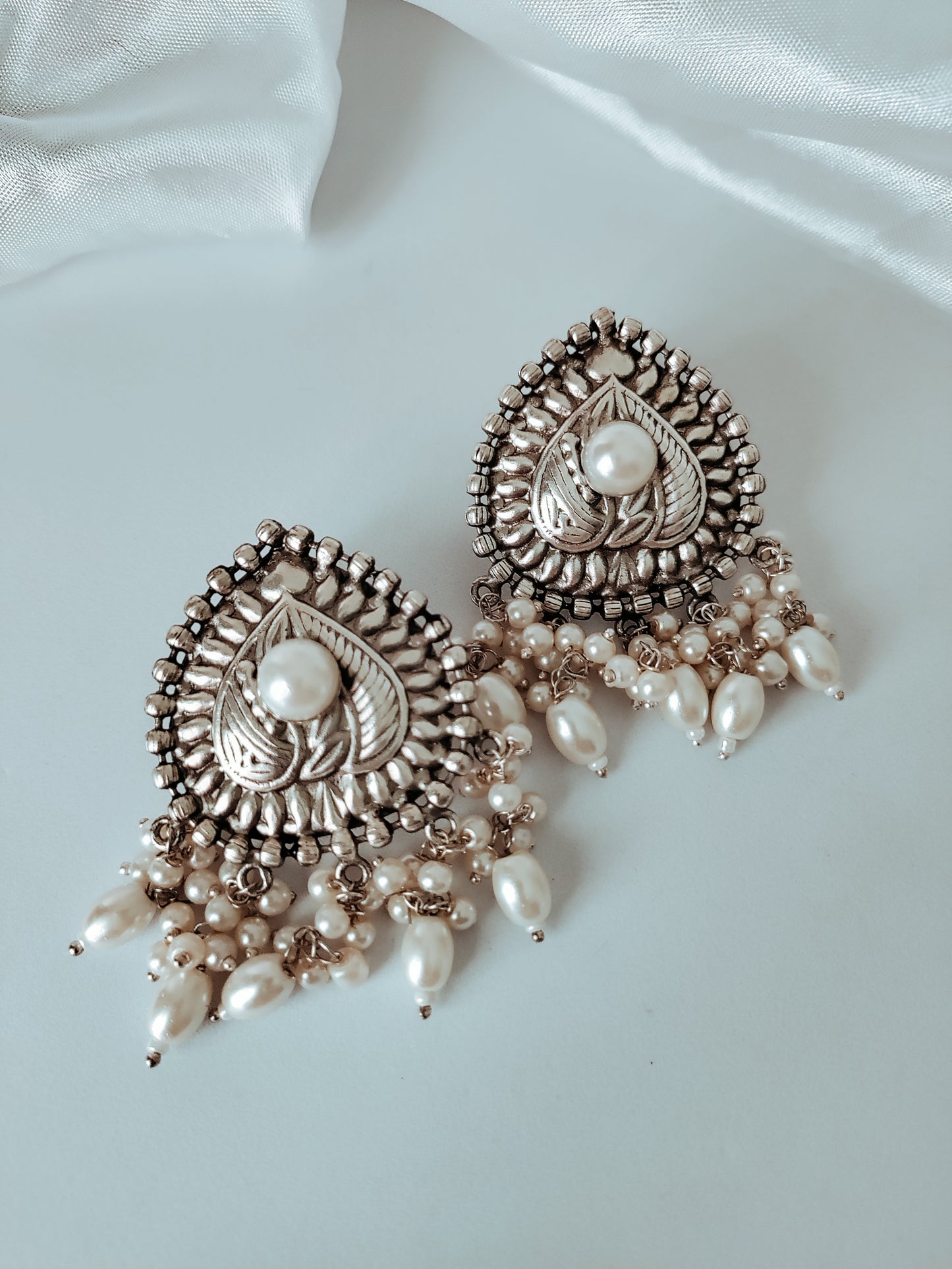 Divya Silver Polish Brass studs earrings with pearls - White
