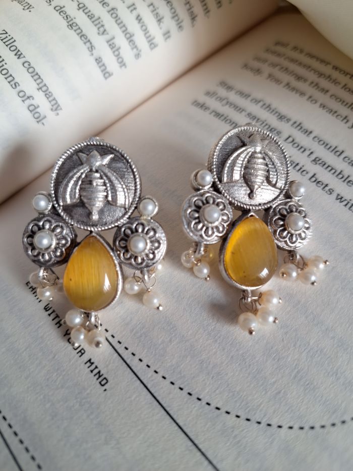 Karma yellow stud earrings