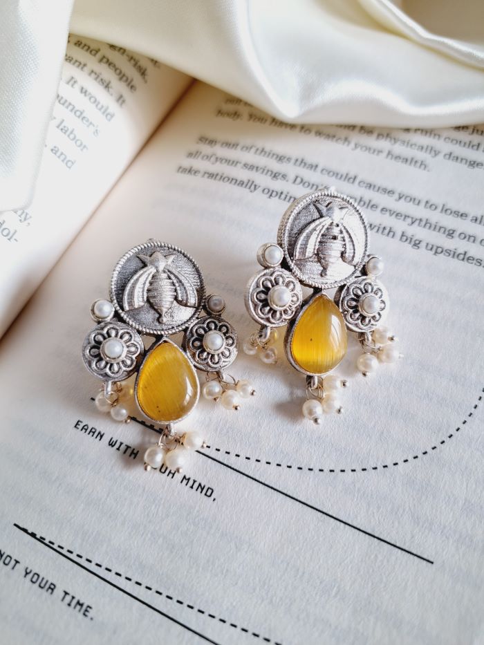 Karma yellow stud earrings