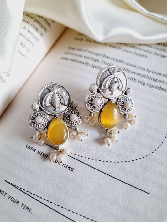 Karma yellow stud earrings