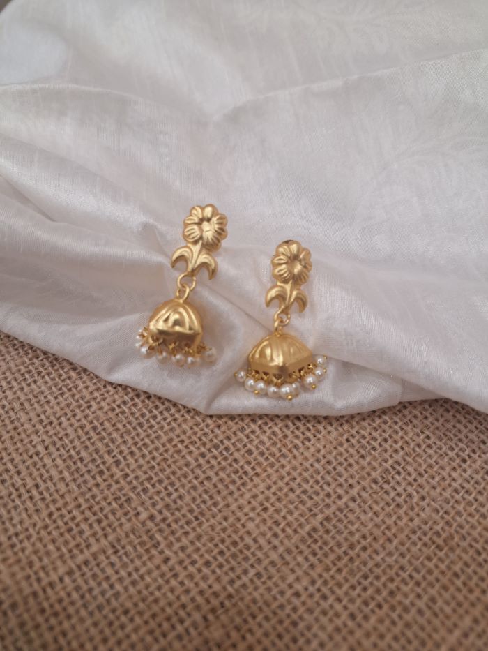 Saadgi golden jhumka earrings